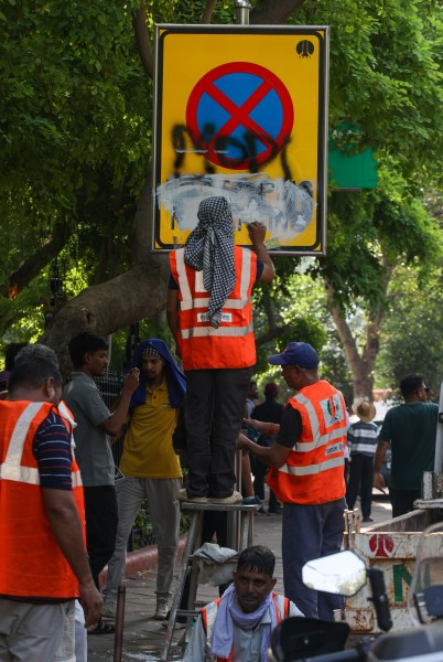 Cleaning work going on a day after CJP protest over, at Jantar Mantar in New Delhi on Sunday. (Express Photo by Praveen Khanna)
