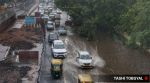 Commuters tread through water logged MB road in New Delhi during the monsoon showers on Thursday. Express Photo by Tashi Tobgyal 090726