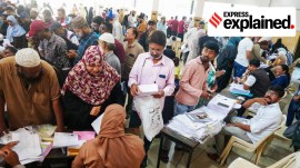 Booth Level Officers (BLOs) distribute and collect Special Intensive Revision (SIR) enumeration forms from voters in Kondhwa, Pune.