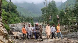 Residents gather in the aftermath of torrential rain-triggered landslides and flash floods, at Dhara Sangla village of Surankote tehsil, in Poonch district, Jammu and Kashmir, Sunday, July 19, 2026. (PTI Photo)