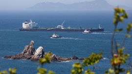Tugboats guide the crude oil tanker Odessa, carrying UAE crude after passing through the Strait of Hormuz at Daesan port. (REUTERS FILE)