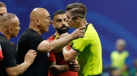 Egypt head coach Hossam Hassan argues with referee Francois Letexier, of France, during the World Cup round of 16 soccer match between Argentina and Egypt in Atlanta, Tuesday, July 7, 2026. (AP Photo/Erik S. Lesser)