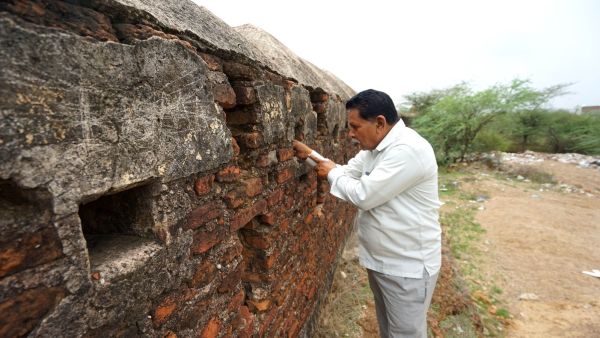 Indroda resident Melaji Thakor, 64, says he grew up playing on the fort’s ramparts and welcomes the Gandhinagar Municipal Corporation’s proposal to restore the centuries-old structure. (Express Photo by Bhupendra Rana)