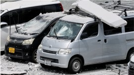 japan earthquake Damaged cars in a parking lot at the Aeon Mall shopping centre, where an explosion occurred after an earthquake with a magnitude of 7.1 struck Japans southern Kumamoto prefecture, July 29, 2026. (REUTERS)