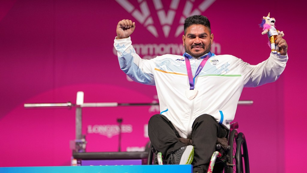 Jhandu Kumar celebrates after winning bronze during the medal ceremony for the men's heavyweight para powerlifting event at the Commonwealth Games 2026 (PTI Photo)