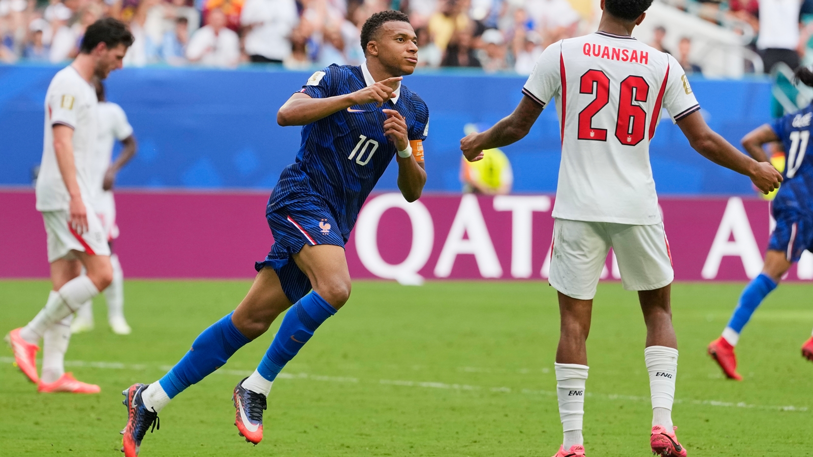France's Kylian Mbappe (10) celebrates scoring his side's third goal as England's Jarell Quansah (26) reacts to the score during the World Cup third-place playoff soccer match between France and England in Miami Gardens, Fla., Saturday, July 18, 2026. (AP Photo/Rebecca Blackwell)