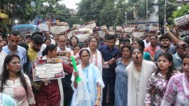 Former West Bengal Chief Minister Mamata Banerjee participates in a candlelight protest rally in south Kolkata (Express Photo)
