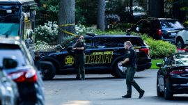 Ottawa County Sheriff's deputies outside the Michigan home where a family of eight was found dead. (AP Photo)