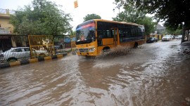 School buses crawl on Gurgaon roads amid rain, Gurgaon rain, Gurgaon rainfall, Gurgaon flooded, delhi news, India news, Indian express, current affairs