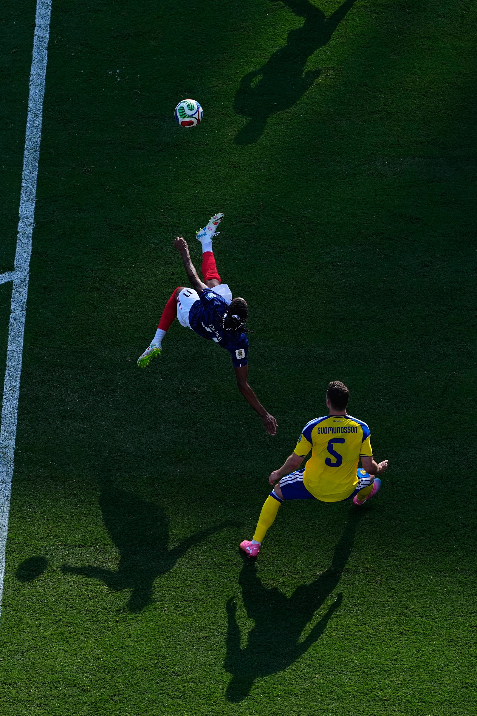 Michael Olise attempts an overhead kick  during the World Cup round of 32 match in East Rutherford, N.J., near New York, Tuesday, June 30, 2026. (AP Photo/Petr David Josek)