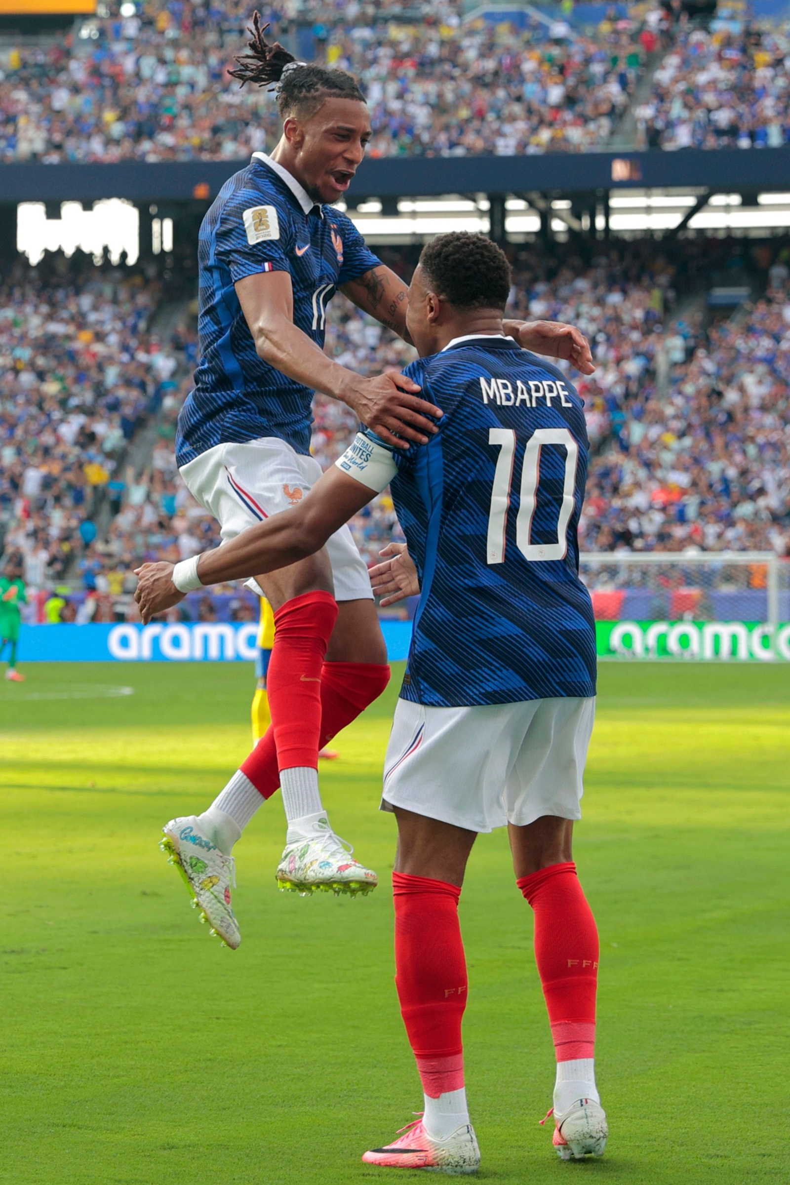 Michael Olise and Kylian Mbappe celebrating France's third goal in the World Cup round of 32 match against Sweden in East Rutherford, N.J., near New York, Tuesday, June 30, 2026. (AP Photo)