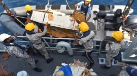 In this photo released by Pakistan Navy, Pakistan Navy personnel shift the wreckage of a cargo plane of the private carrier K2 Airways into a naval ship after recovering them from deep sea near Omara, a town some 360 kms. west of Karachi, Wednesday. (AP)