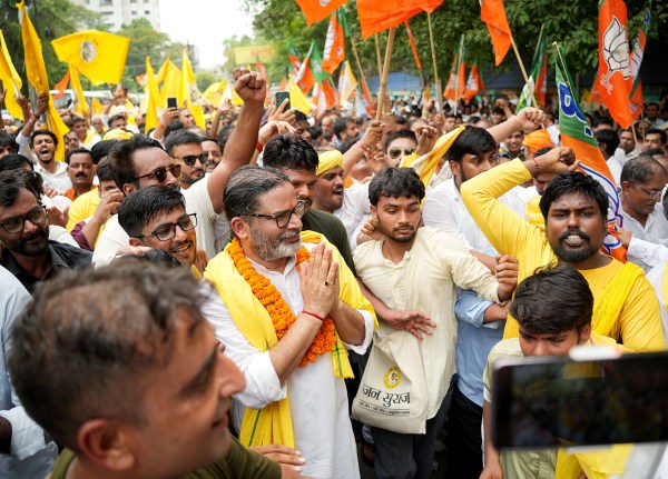 Jan Suraaj Party Bankipur Assembly bypoll candidate Prashant Kishor greets supporters during a roadshow of the BJP and Jan Suraaj Party for the Bankipur Assembly bypoll, in Patna on Monday. (ANI Photo)