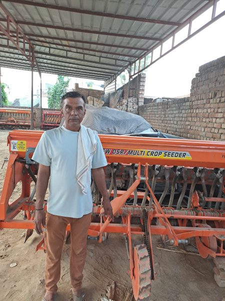 praveen kumar with his paddy machine