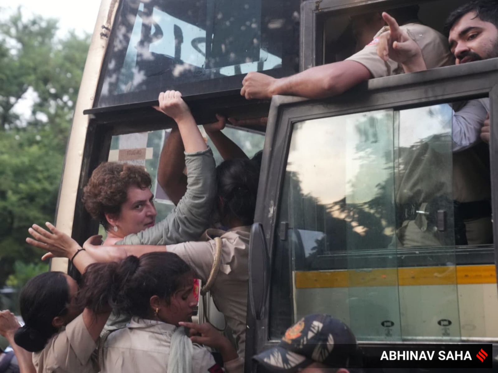 Security personnel detain Congress MP Priyanka Gandhi Vadra during a sit-in protest near the Prime Minister's residence over alleged irregularities in the NEET examination, in New Delhi