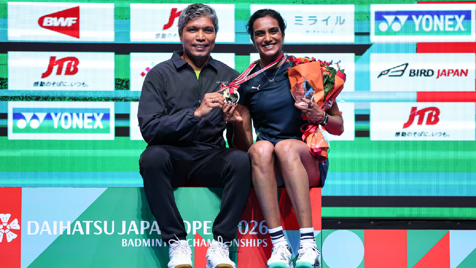 PV Sindhu with coach Irwansyah after winning Japan Open 2026. (BadmintonPhoto)