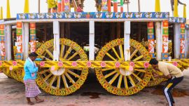 Artisans paint a chariot as preparations are underway ahead of the annual Jagannath Rath Yatra, in Puri, Odisha (PTI Photo)