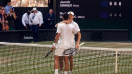 Jannik Sinner embraces Novak Djokovic after winning the 2026 Wimbledon semi final (REUTERS Photo)