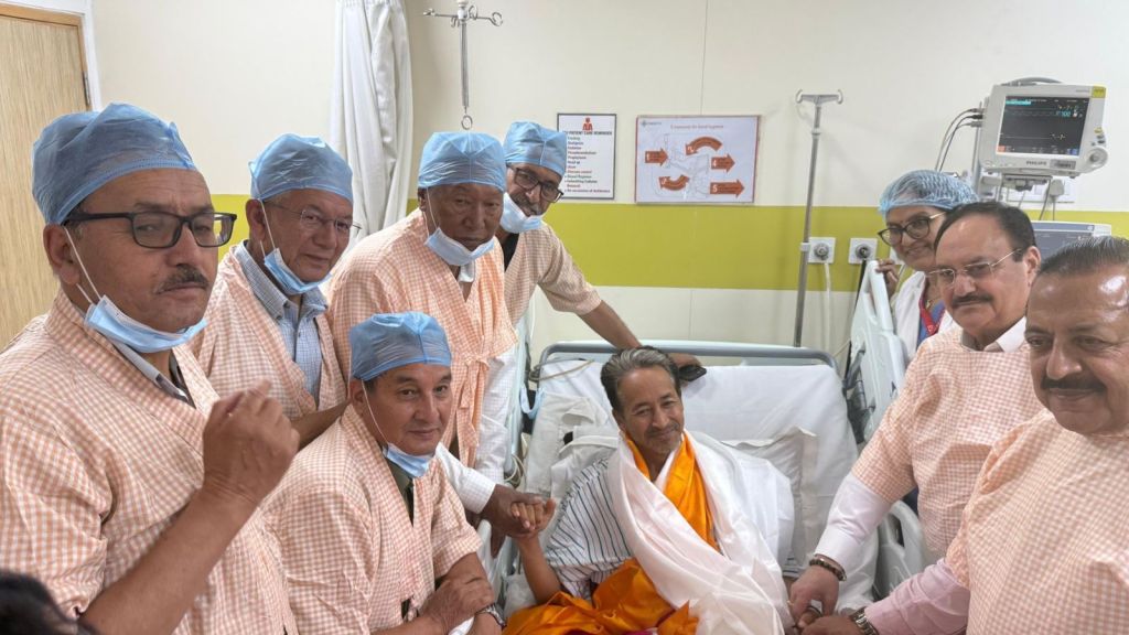 Union Health Minister JP Nadda offers a drink to social activist and educator Sonam Wangchuk as Union Minister of State Jitendra Singh looks on during the breaking of Wangchuk's 26-day indefinite hunger strike. (PTI Photo)