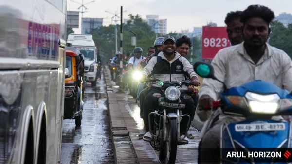 Ignoring traffic rules, two-wheeler riders use the footpath on Sangam Bridge near COEP as a shortcut, leaving little space for pedestrians on Tuesday. Express Photo by Arul Horizon