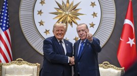 President Donald Trump shakes hands with Turkish President Recep Tayyip Erdogan as he arrives for the NATO summit in Ankara, Tuesday. (AP)