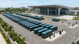 A fleet of electric buses parked at a modern transport depot, representing Uttar Pradesh's push to strengthen sustainable public transport. (Image generated using AI)