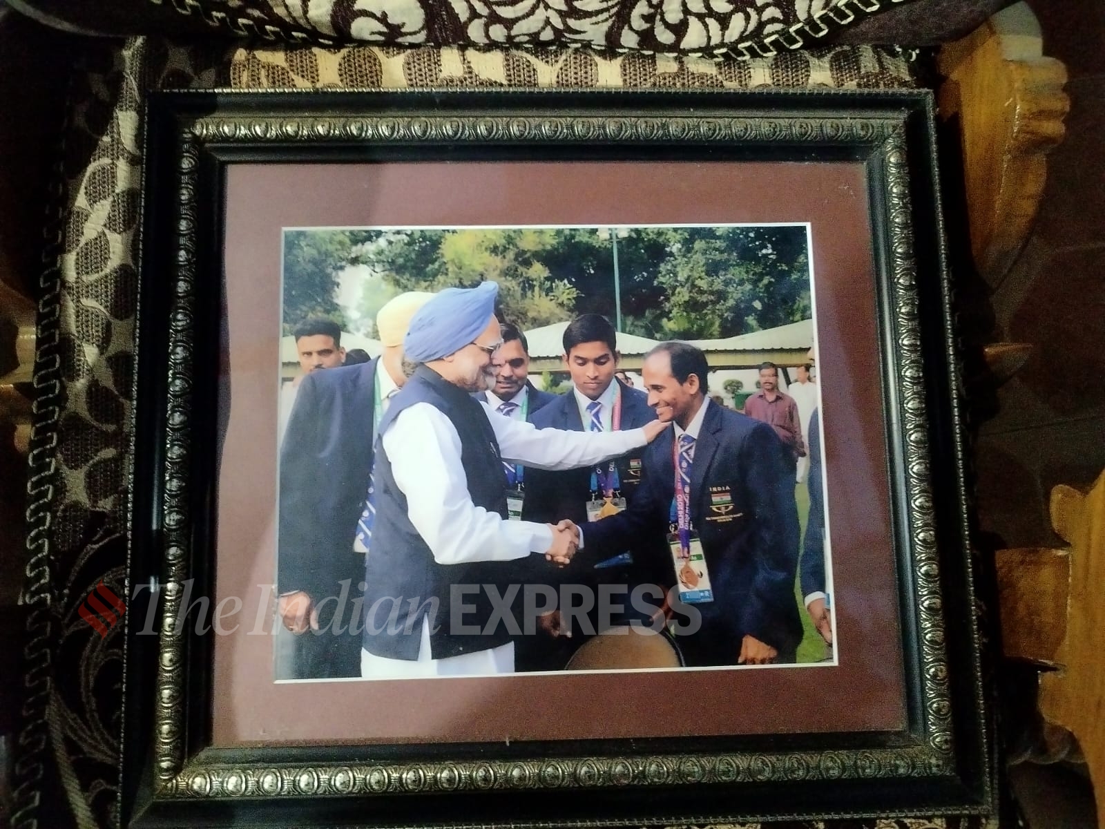 Valluri Srinivas Rao with then Prime Minister Manmohan Singh. (Express photo by Tanishq Vaddi)