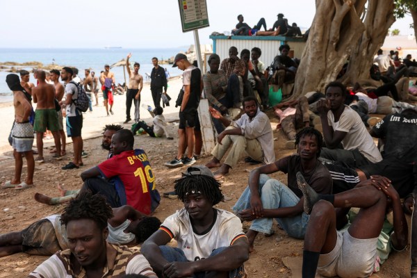 Migrants gather in Ceuta, Spain, following recent mass crossings of migrants on foot and by sea from Morocco into Spanish territory, August 1, 2026. (REUTERS)
