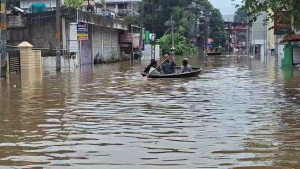 Pathanamthitta District Administration deploys additional boats to rescue people from the flood-affected area at Ranni, in Pathanamthitta on Saturday. Flash floods from the hilly regions caused overflow of the Pamba River. (ANI Video Grab)