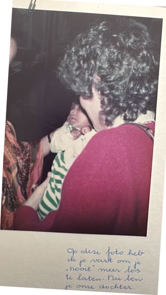 Joke Getlink holds onto baby Meena, after she lands in Amsterdam. Credit: Meena Getlink