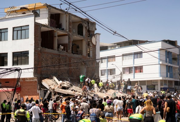 Residents and emergency personnel dig through the debris of a collapsed building after an earthquake, in Cali, Colombia August 10, 2026. (REUTERS)