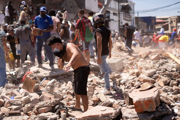 Residents dig through the debris of a collapsed building after an earthquake, in Cali, Colombia August 10, 2026. (REUTERS)