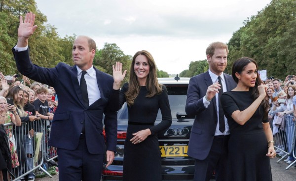 Britain's William, Prince of Wales, Catherine, Princess of Wales, Britain's Prince Harry and Meghan, the Duchess of Sussex, wave to members of the public at Windsor Castle, following the passing of Britain's Queen Elizabeth, in Windsor, Britain, September 10, 2022. (REUTERS)