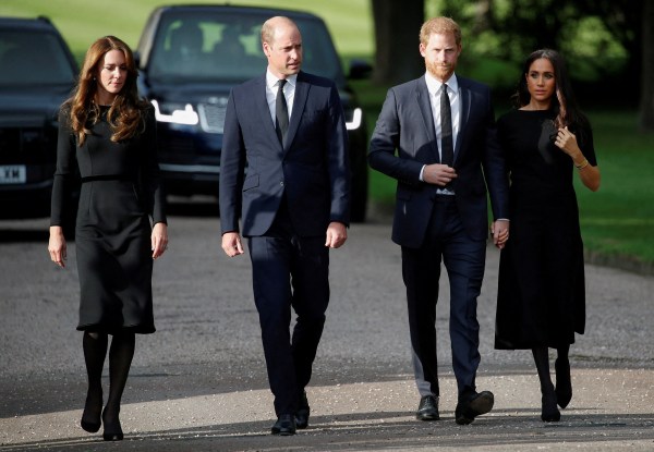 Britain's William, Prince of Wales, Catherine, Princess of Wales, Prince Harry and Meghan, the Duchess of Sussex walk outside Windsor Castle, following the passing of Britain's Queen Elizabeth, in Windsor, Britain, September 10, 2022. (REUTERS)