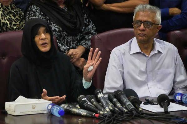 Former Pakistani Prime Minister Imran Khan's sister Uzma Khan, left, speaks as Khan's personal physician Faisal Sultan watches during a press conference in Islamabad, on Aug. 21, 2026. (AP Photo)