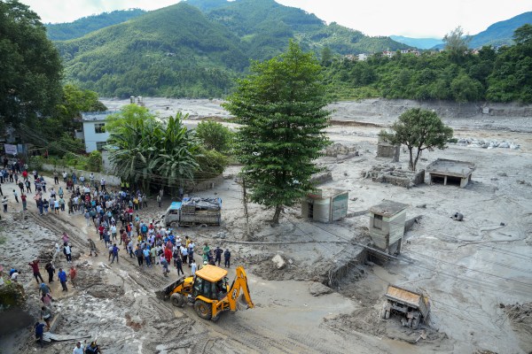 Search and rescue operation underway in the aftermath of the devastating flash flood, at Trishuli Dam, in Nuwakot district, Nepal, Thursday. (PTI)