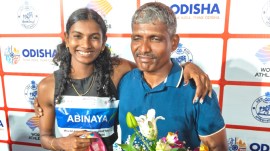 Abinaya Rajarajan with her father Rajarajan after winning the women's 100 metres title at the World Athletics Continental Tour Silver event. Credit: Express