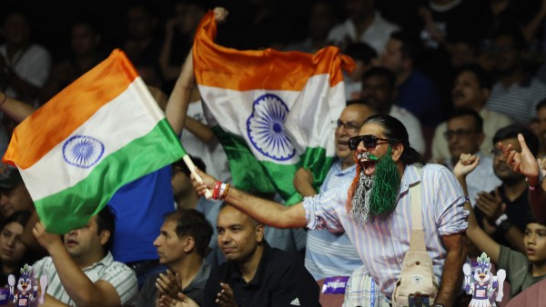 Spectators display India flags during the womens doubles semi final match between Indias Treesa Jolly and Gayatri Gopichand Pullela and Chinas Sheng-Shu Liu and Ning Tan. (Reuters)