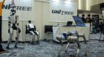 A Unitree booth at a robotics convention in Tokyo, May 29, 2026. Unitree Robotics wants to raise about $900 million in an IPO that tests market interest in humanoid robots, a technology that wows but has yet to prove its viability. (Hiroko Masuike/The New York Times)