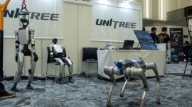 A Unitree booth at a robotics convention in Tokyo, May 29, 2026. Unitree Robotics wants to raise about $900 million in an IPO that tests market interest in humanoid robots, a technology that wows but has yet to prove its viability. (Hiroko Masuike/The New York Times)
