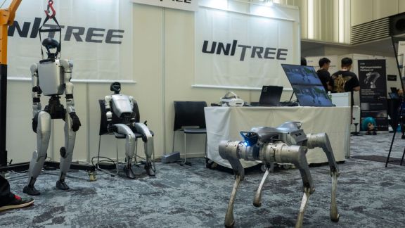 A Unitree booth at a robotics convention in Tokyo, May 29, 2026. Unitree Robotics wants to raise about $900 million in an IPO that tests market interest in humanoid robots, a technology that wows but has yet to prove its viability. (Hiroko Masuike/The New York Times)