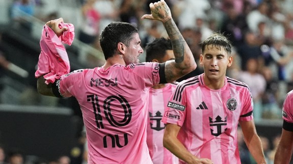 Inter Miami midfielder Rodrigo de Paul, left, celebrates after scoring a goal, wearing the shirt of teammate Lionel Messi (10) who did not play due to death of his father, during the first half of a Leagues Cup soccer match against Monterrey, Saturday, Aug. 8, 2026, in Miami. (AP Photo/Lynne Sladky)