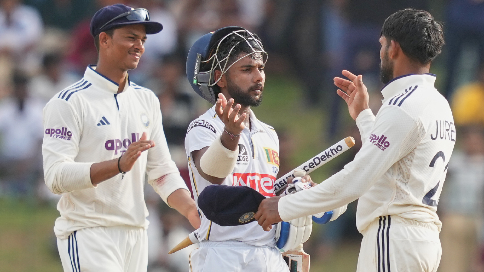Sri Lanka's Sonal Dinusha is congratulated by the India's team members at the end of the day five of the second cricket test match between Sri Lanka and India in Colombo, Sri Lanka, Thursday, Aug. 27, 2026.