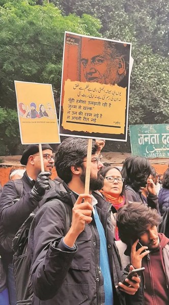 Faiz on a poster at a protest in Jantar Mantar in Delhi. (File Photo) 