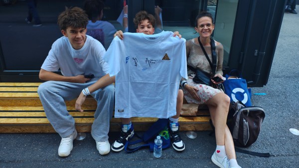 Octave with signed T-shirt with his brother and mother. (Express Photo)