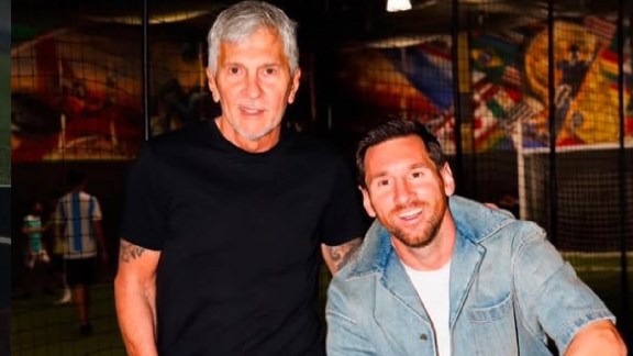 Lionel Messi with his father