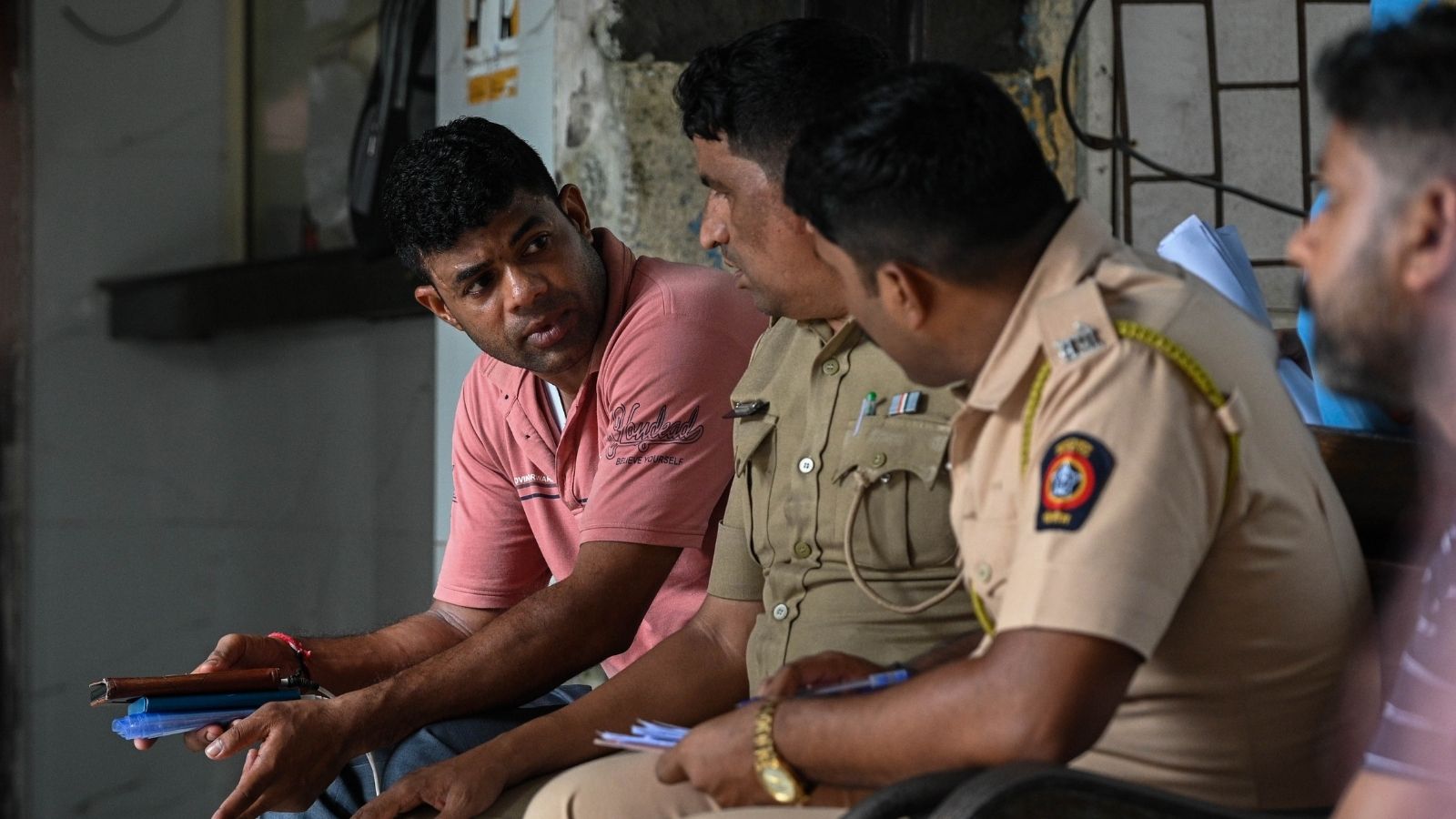 Brijlal Mehra (extreme left), brother of Puranmal Shambhulal Mehra, an Indian Navy sailor who was found dead last night, waits at the Postmortem Centre to collect the deadbodies, at JJ Hospital in Mumbai on 16 August 2026. The sailor along with his wife and two children were found dead last night.