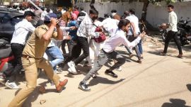 Police personnel resort to a lathi charge on protesters demanding a salary hike, in Noida. (Source: PTI Photo)