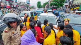 Students of Jay Prakash Narayan Sarvodaya Balika Vidyalaya stage a road blockade protest over the shortage of teaching staff and the dilapidated condition of the road, in Lucknow on August 17. (ANI Photo)