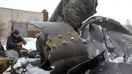 A man photographs parts of an unidentified missile, which Ukrainian authorities believe to be made in North Korea and was used in a strike in Kharkiv earlier this week, amid Russias attack on Ukraine, in Kharkiv, Ukraine January 6, 2024. (REUTERS)